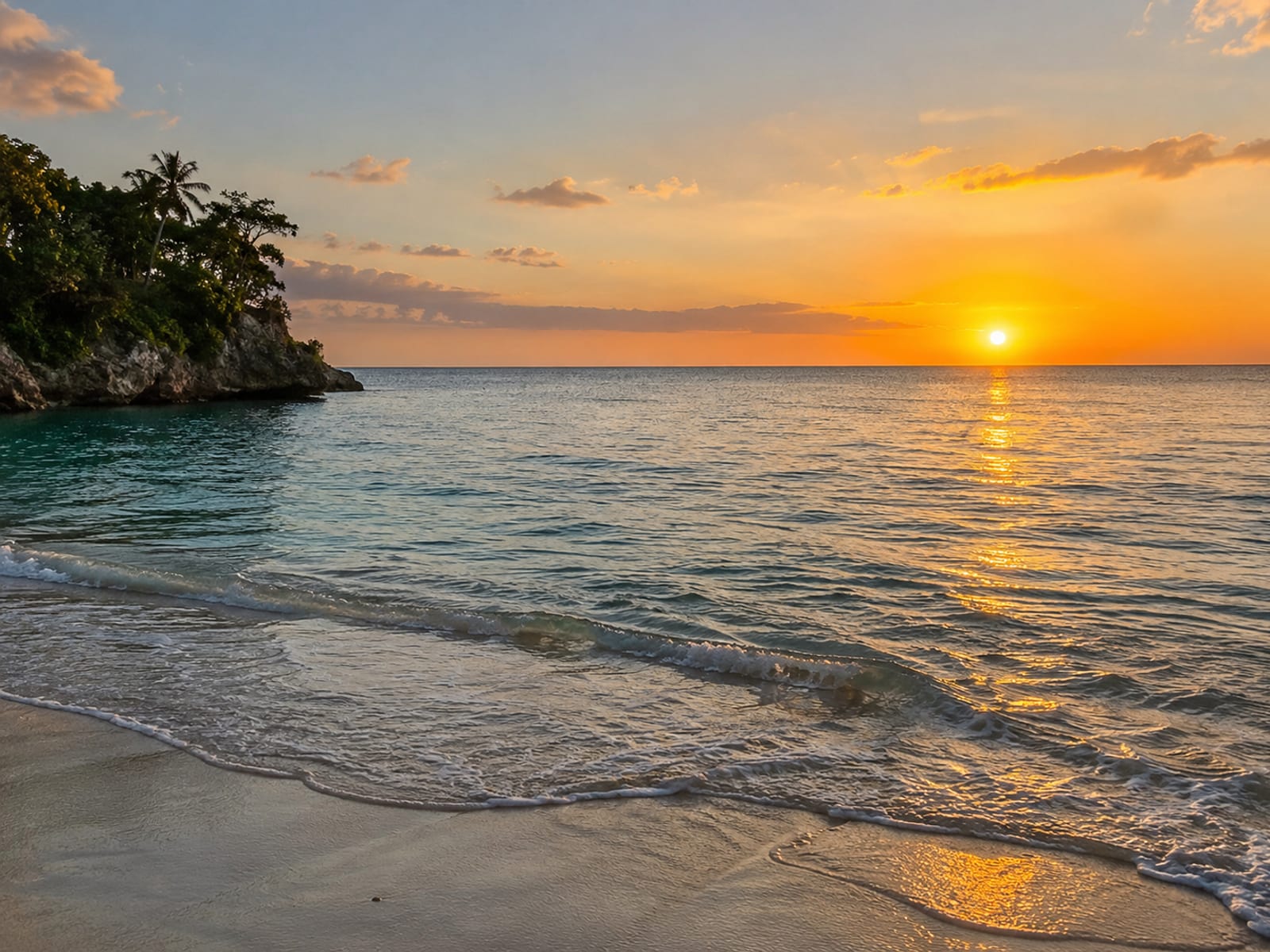 A calm bay with an open horizon at golden hour